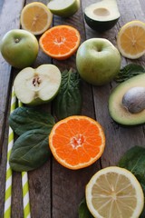 Various citrus fruits on a wooden surface. Fruit food background. Healthy eating and diet.