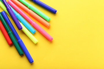 Felt-tip pens on a yellow background