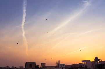 sky at sunset showing kites flying on Uttaryan