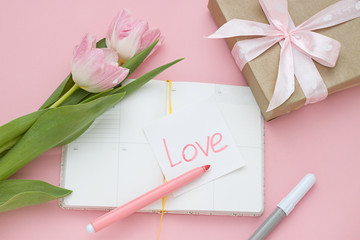 Pink Valentines flat lay with a note