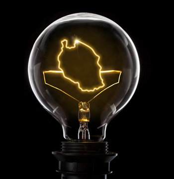 Lightbulb with a glowing wire in the shape of Tanzania (series)
