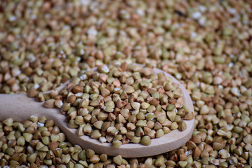 Buckwheat in a wooden spoon close-up