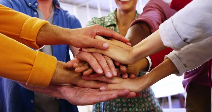 Group of happy business executives with hand stack in office 4k