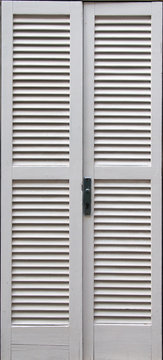 Close-up view of white wooden door.