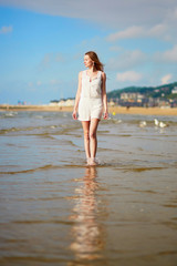 Young woman enjoying her vacation by sea