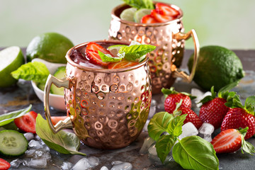Moscow mule cocktail with lime and strawberry - Powered by Adobe