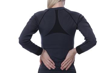 Back Pain. Athletic fitness woman rubbing the muscles of her lower back. Sports exercising injury.