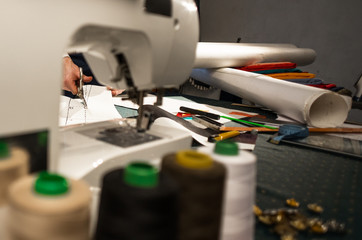 The cutter cuts out the pattern of clothing made of paper