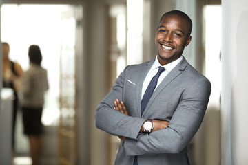 Smiling boss ceo at office work place portrait of worker in suit and tie looking handsome