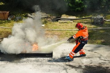 Firefighters fighting fire during training