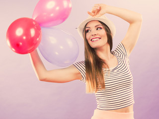 Cheering girl with balloons.