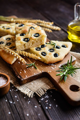 Traditional Italian Focaccia with black olives and rosemary