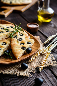 Traditional Italian Focaccia with black olives and rosemary