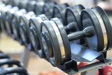 The image of dumbbells in fitness hall