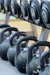 The image of dumbbells and weights in fitness hall