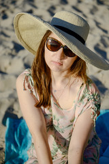 Young happy woman on the beach