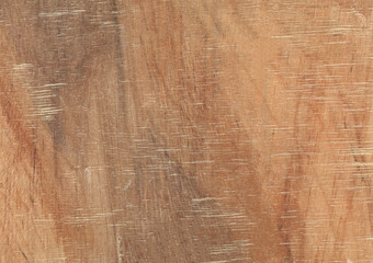 Brown scratched wood texture with natural pattern. Chopping board, table or floor surface