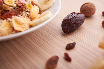 flakes with dried fruit, granola on the plate