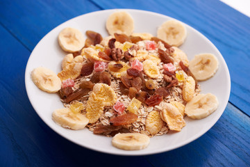 flakes with dried fruit, granola on the plate