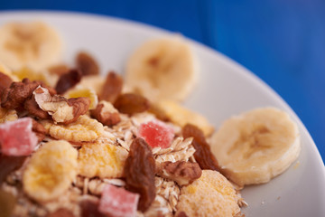 flakes with dried fruit, granola on the plate