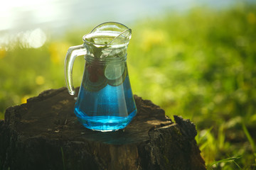 Cool refreshing drink on the background of nature