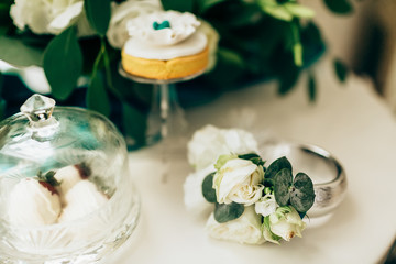Romantic flowers and cake on table