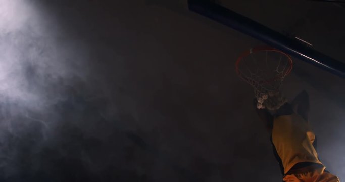 Sportsman dunking basketball in hoop at basketball court 4k