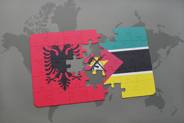puzzle with the national flag of albania and mozambique on a world map
