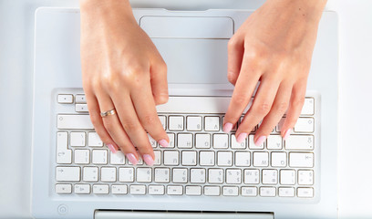 Fototapeta na wymiar Woman working on laptop, sitting at the desk