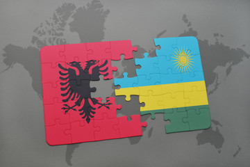 puzzle with the national flag of albania and rwanda on a world map