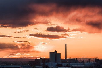 Fototapeta na wymiar Industrial buildings at sunset