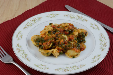 Cheese ravioli with spinach and chicken in marinara sauce