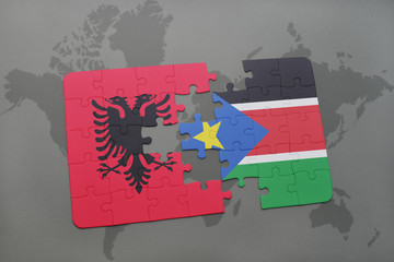 puzzle with the national flag of albania and south sudan on a world map