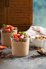 Healthy chocolate banana smoothie with granola