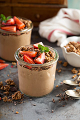 Healthy chocolate banana smoothie with granola