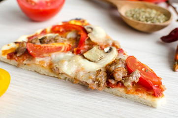 Slice of hot meat italian pizza