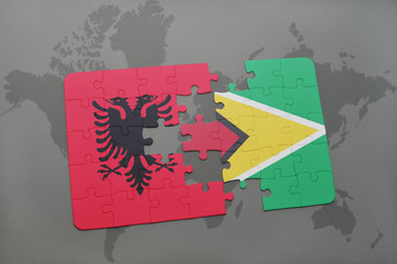 puzzle with the national flag of albania and guyana on a world map