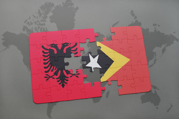 puzzle with the national flag of albania and east timor on a world map