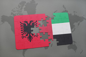 puzzle with the national flag of albania and united arab emirates on a world map