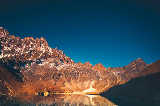 Himalaya Mountain landscape. Dudh pokhari Gokyo lake and Phari Lapche peak at sunrise - Gokyo - Way to Cho Oyu Base Camp - Nepal. Beautiful nature landscape. Travel background.