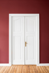 white door on red wall