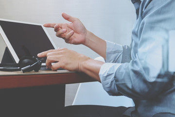 business man using VOIP headset with digital tablet computer doc