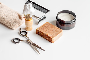 white desktop with tools for shaving beards
