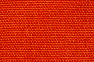 Close up of orange canvas texture or background