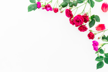 Frame with red flowers, branches, leaves and petals isolated on white background. flat lay, overhead view