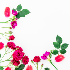 Round frame with red flowers, branches, leaves and petals isolated on white background. flat lay, overhead view