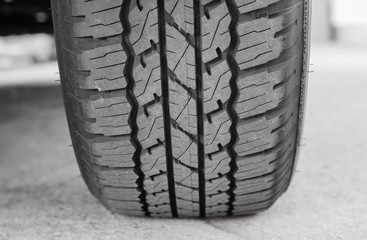 New tire full of tire tread / Checking tire tread depth for road safety