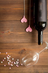 concept Valentine Day with wine at wooden background top view