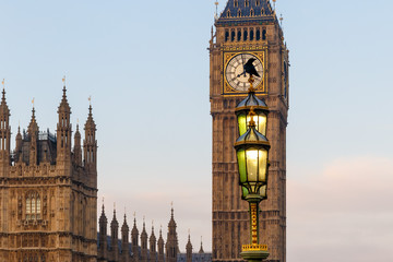 Raven on lampost at Houses of Parliament in early winter morning