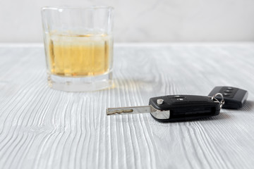 concept of alcohol and driving on wooden background